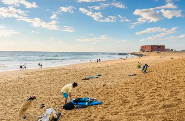 Sunny Capbreton beach with beginner surfboards on the sand near Santocha.